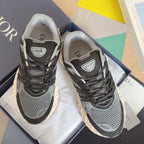 Dior unisex sneaker in dark gray/black with mesh uppers and chunky cream tread sole