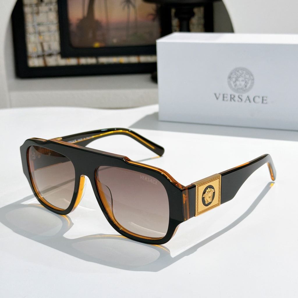 Tortoise cat-eye sunglasses with tinted lenses and gold logo plaque