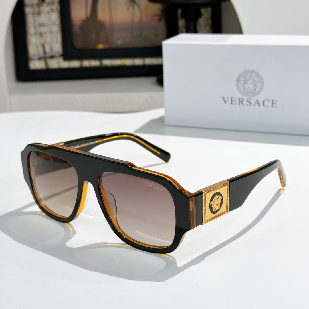 Tortoise cat-eye sunglasses with tinted lenses and gold logo plaque