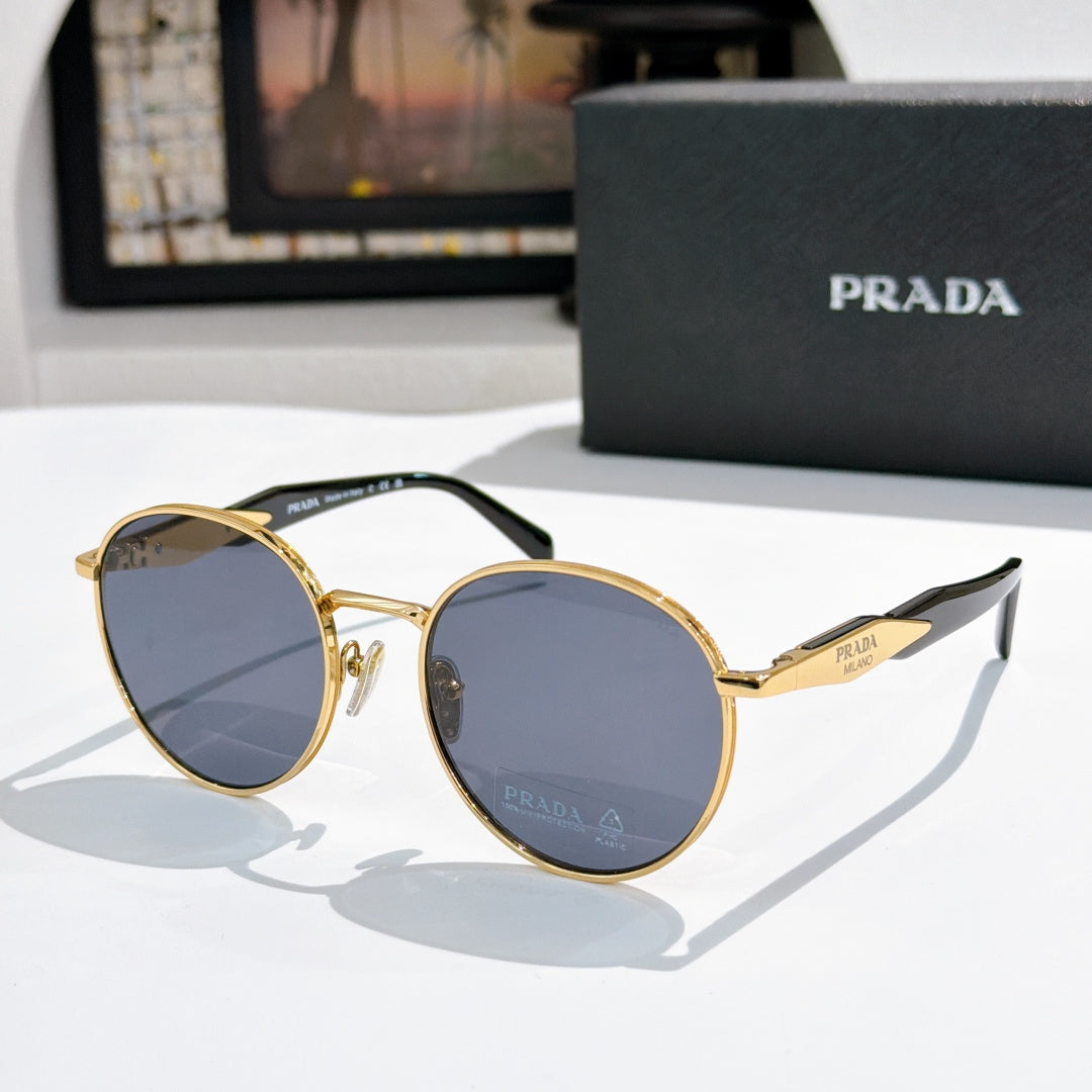 Prada sunglasses with gold metal round frames and blue tinted lenses