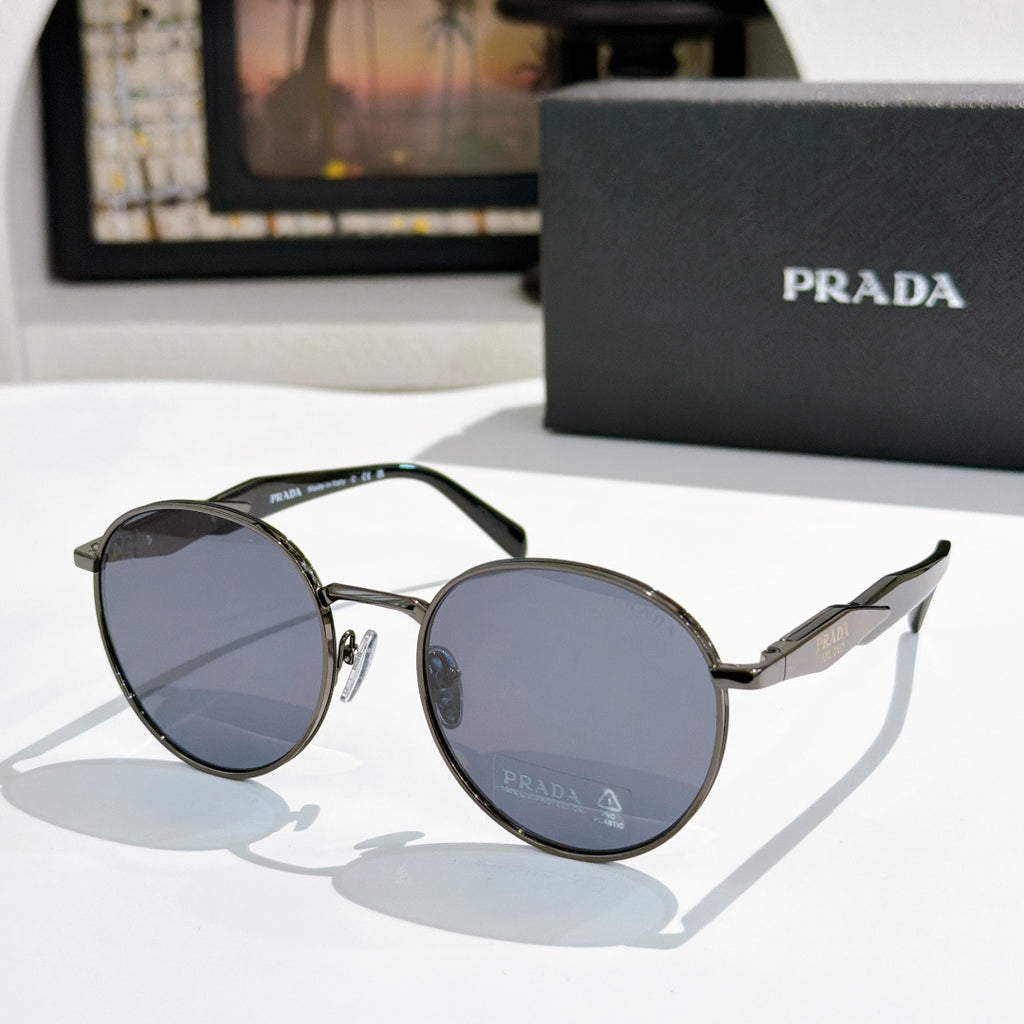 Prada sunglasses with silver metal round frames and dark blue tinted lenses