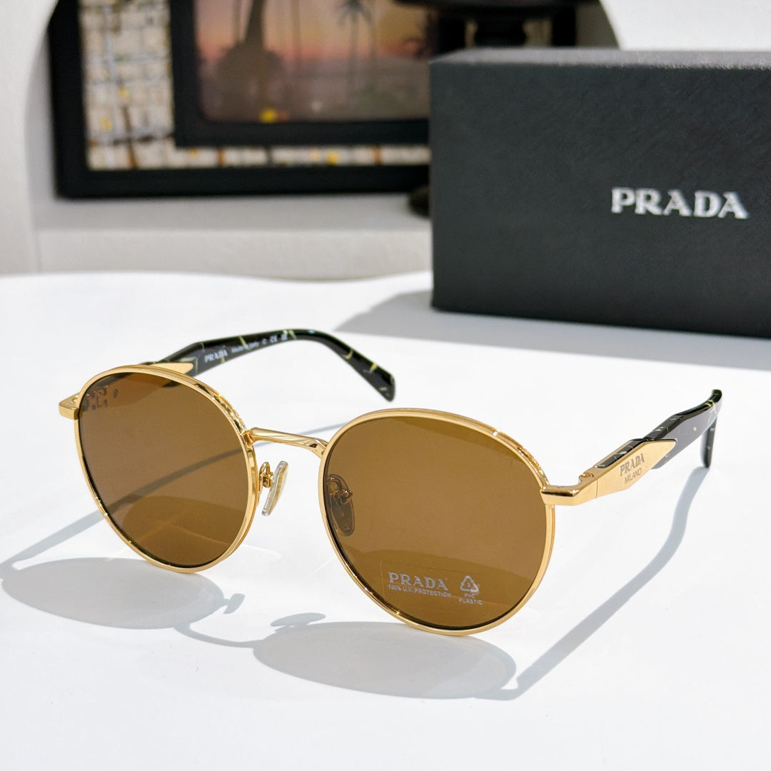 Prada sunglasses with gold metal round frames and brown tinted lenses
