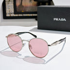 Prada sunglasses with silver metal round frames and pink tinted lenses