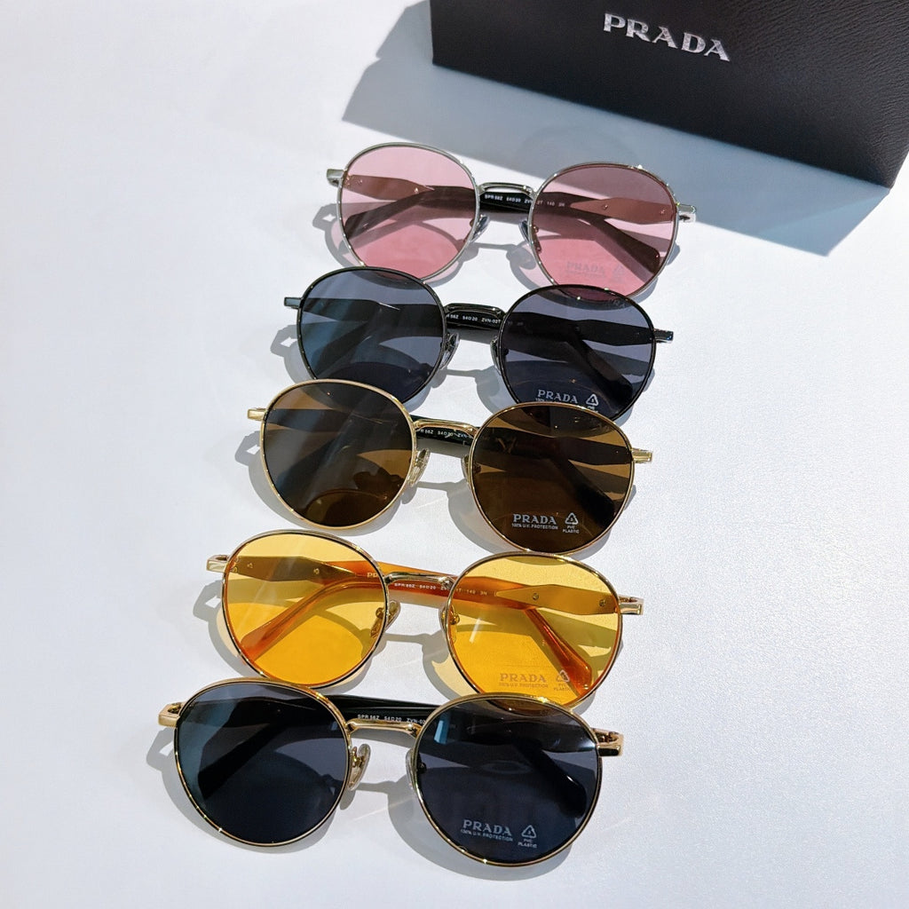Prada sunglasses in mixed colors: pink, navy, brown, and yellow tinted lenses