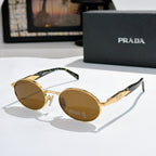 Prada round sunglasses with gold-tone frames and amber tinted lenses