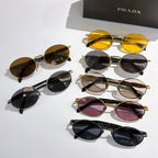 Assorted Prada sunglasses set with mixed frames and tinted lenses, top view