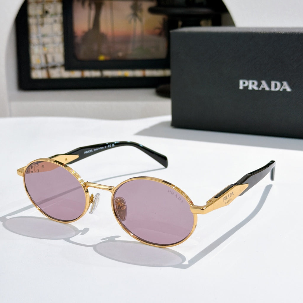 Prada round sunglasses with gold-tone frames and purple tinted lenses