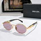Prada round sunglasses with gold-tone frames and purple tinted lenses