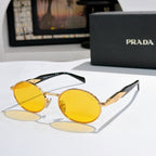 Prada round sunglasses with gold-tone frames and yellow tinted lenses