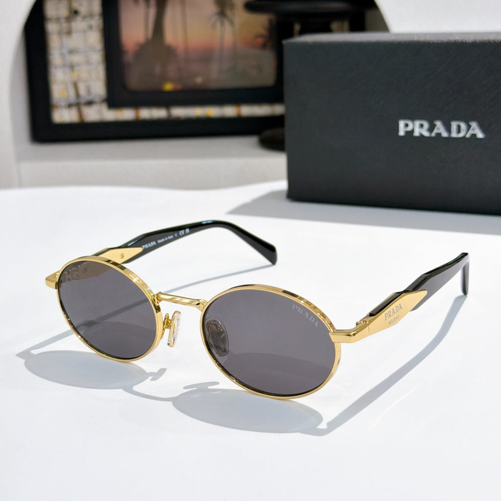 Prada round sunglasses with gold-tone frames and dark gray tinted lenses