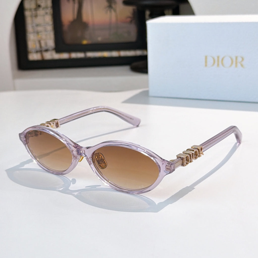 Sunglasses with translucent light purple frames, gold logo detail, tan lenses