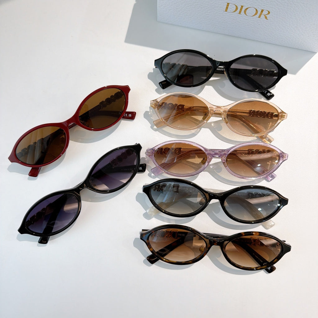 Sunglasses assortment, red, black, tan and purple frames with tinted lenses