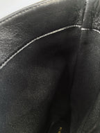 Black leather boot shaft fabric close-up with interior lining