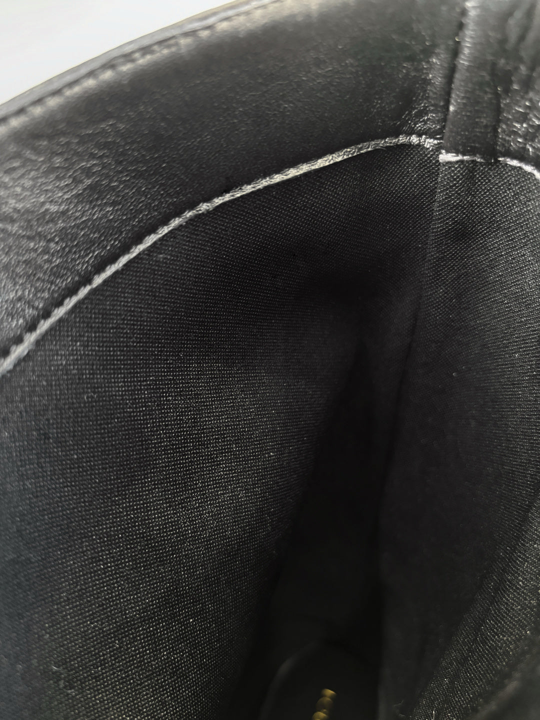 Black leather boot shaft fabric close-up with interior lining