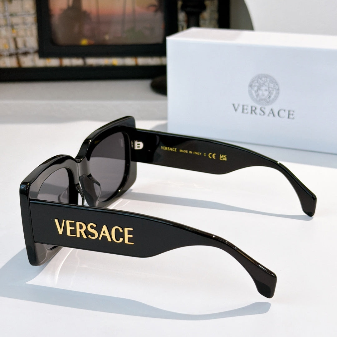 Versace sunglasses, black thick frames with tinted lenses and VERSACE logo on arm