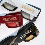 Versace sunglasses in black, red, and blue with VERSACE logo on temples