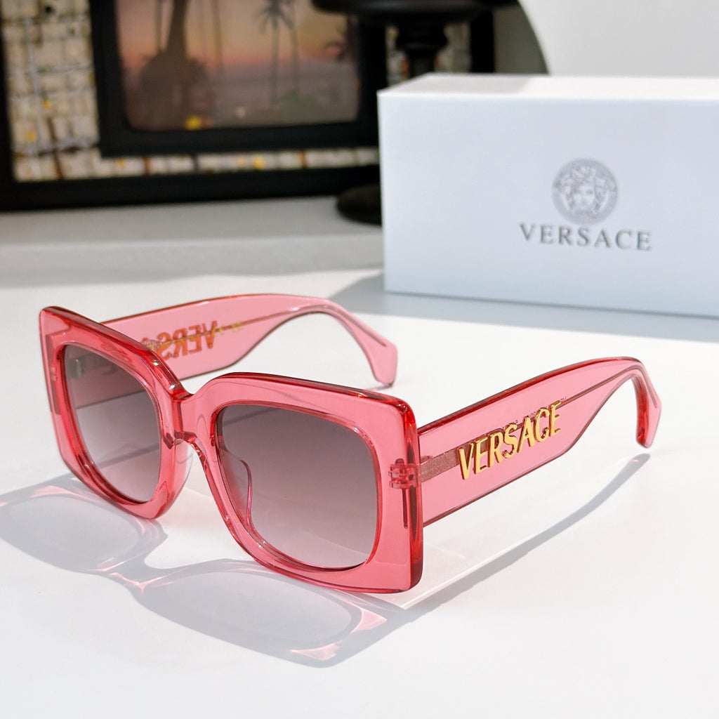 Versace sunglasses, pink cat-eye frames with tinted lenses and logo on the temple