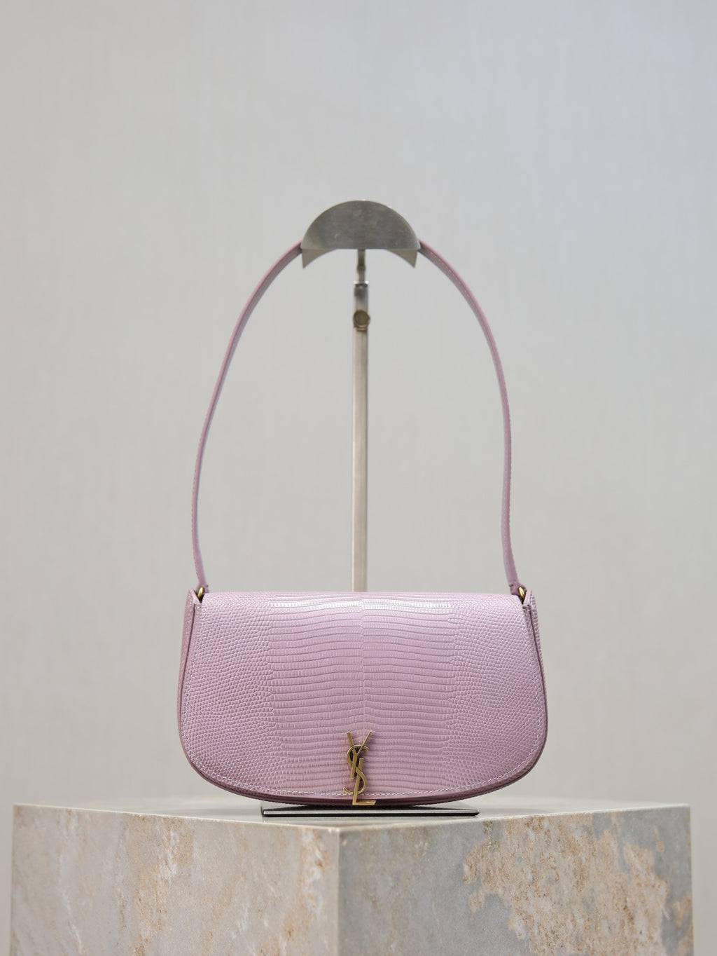 YSL small pink crossbody bag with curved flap, gold-tone logo clasp, textured finish