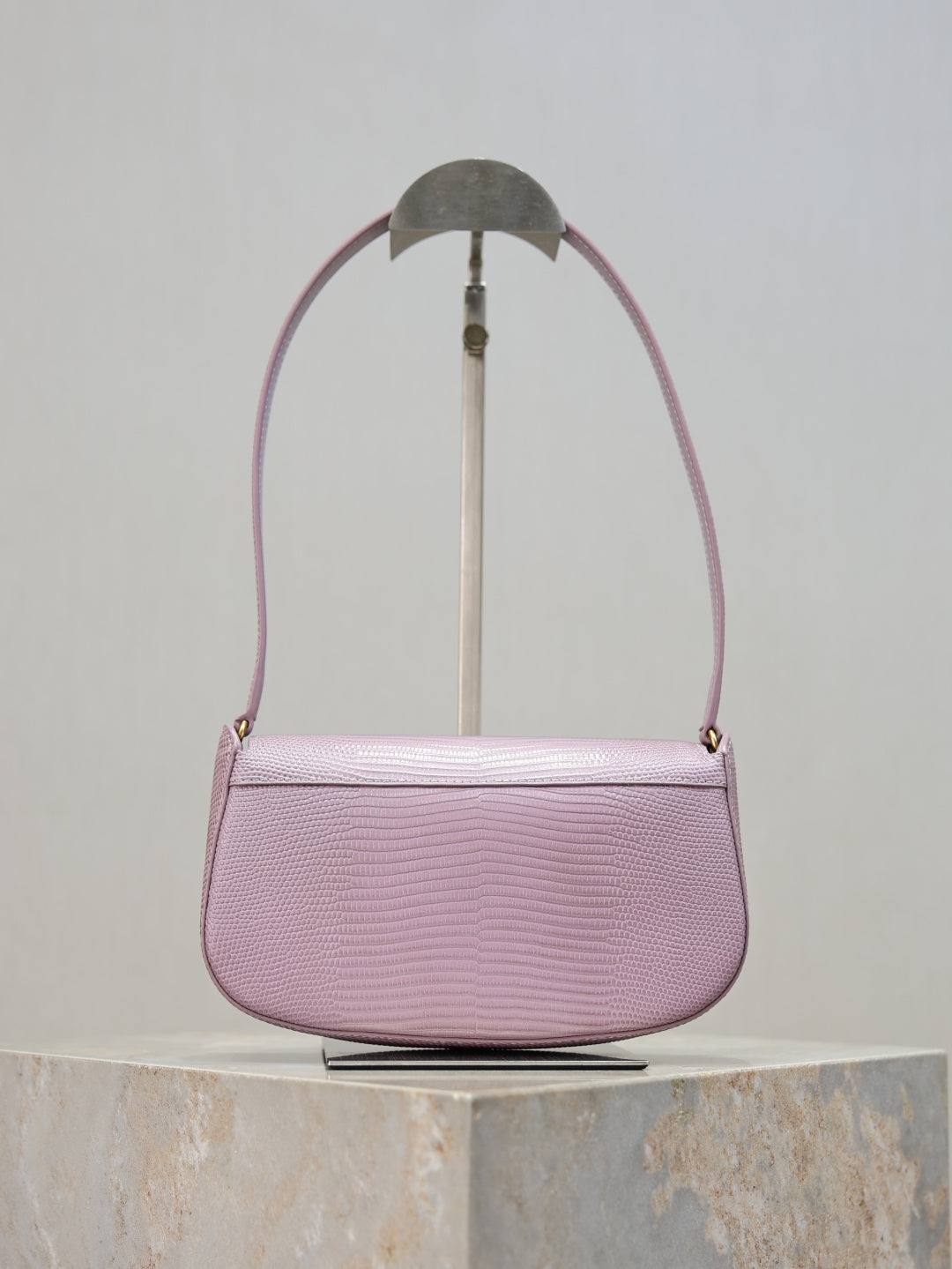 YSL small pink crossbody bag front view with gold-tone logo clasp and textured finish