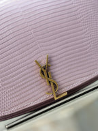 YSL small pink bag close-up of gold-tone logo clasp on textured flap