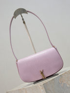 YSL small pink crossbody bag, side view with curved flap and gold-tone logo clasp