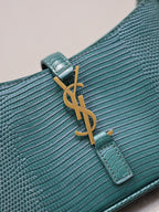 YSL small handbag logo detail on teal textured leather with gold YSL hardware and tab.