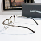 Metal eyeglass frames with clear lenses and black temple arms