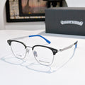 Metal eyeglass frames with clear lenses and blue temple tips