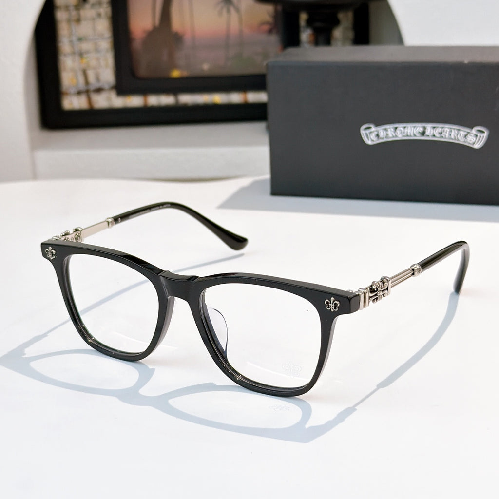Black full-rim eyeglasses with clear lenses and silver decorative temples