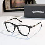 Black full-rim eyeglasses with clear lenses and silver decorative temples