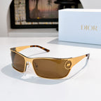 Amber-tinted sunglasses with gold frame and tortoise brow.