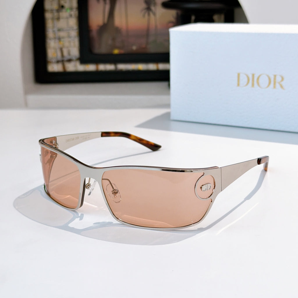 Peach-tinted sunglasses with light frame and tortoise temples.