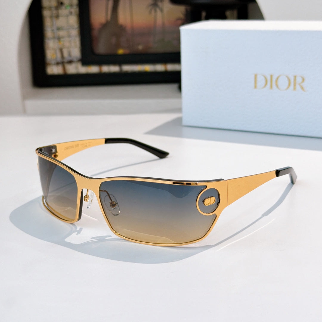 Blue gradient-tinted sunglasses with gold frame and tortoise edges.