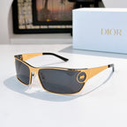 Dark-tinted sunglasses with gold frame and black temple tips.
