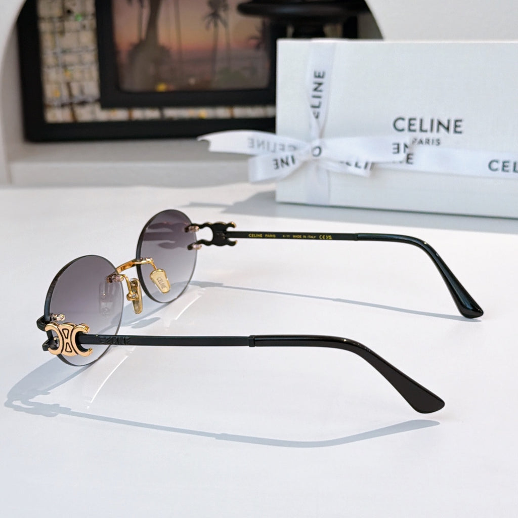 Celine round sunglasses with dark lenses and dark arms with gold details