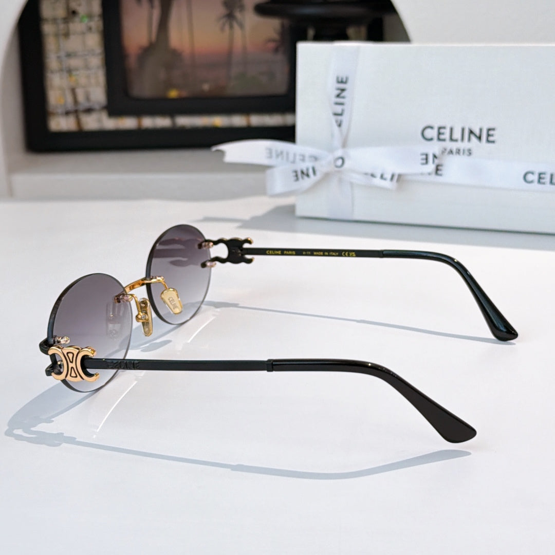 Celine round sunglasses with dark lenses and dark arms with gold details