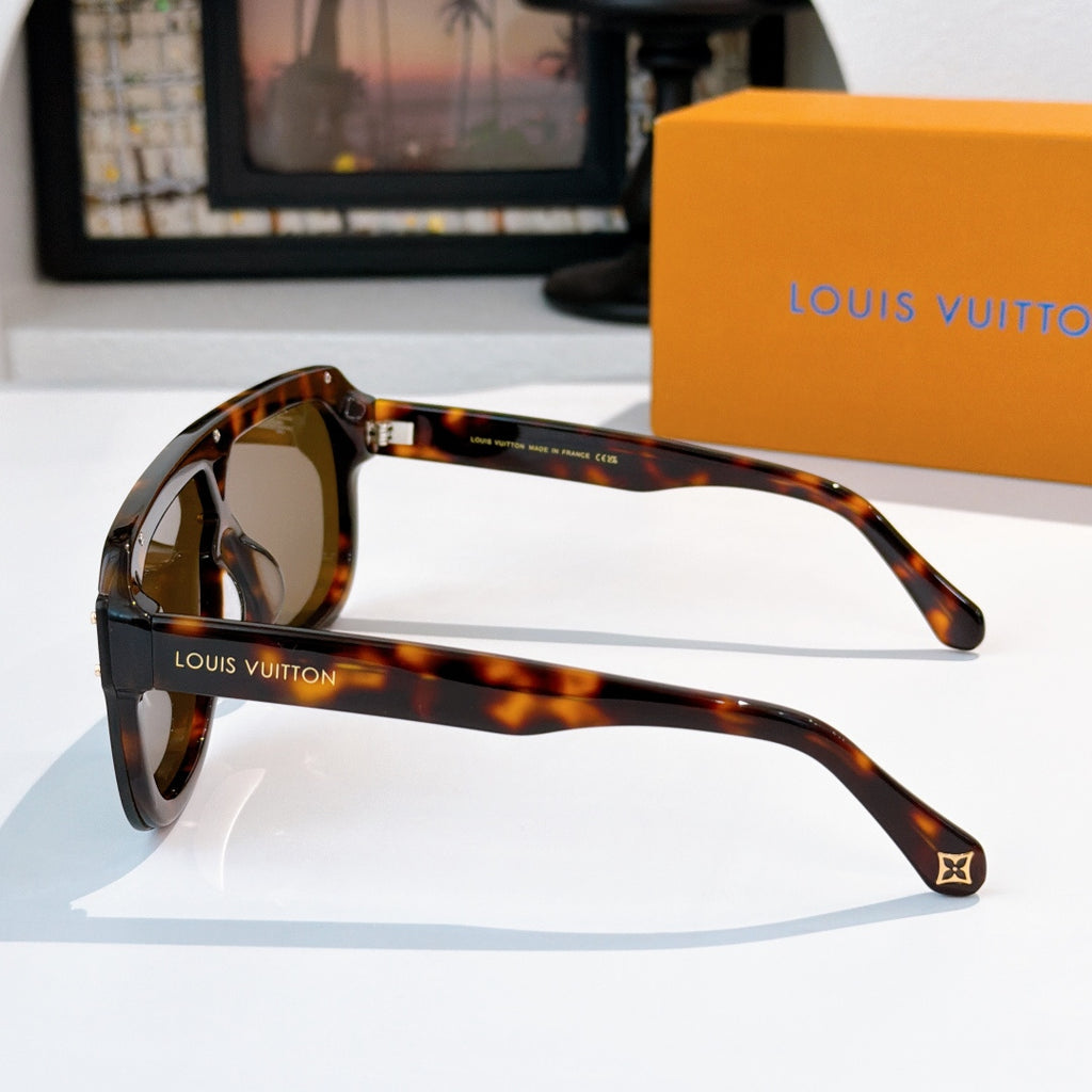 Sunglasses side view with tortoiseshell frames and brown tinted lenses, metal hinge accents.
