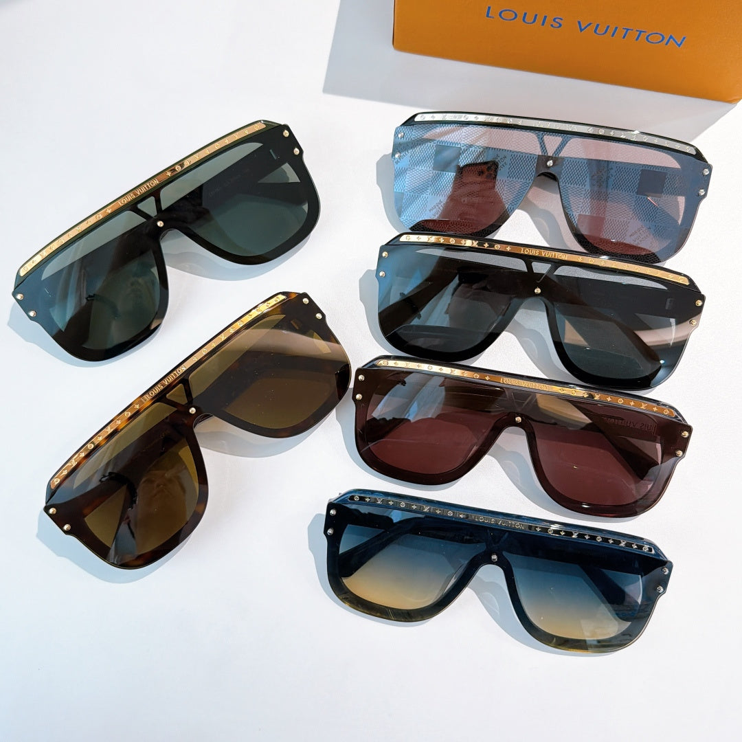 Assorted sunglasses set on display with dark, blue, and tortoiseshell frames and tinted lenses.