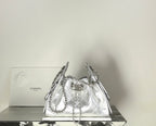 Silver metallic drawstring handbag with quilted body and chain shoulder straps