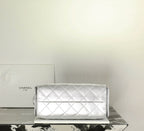 Silver quilted flap shoulder handbag with chain strap and clasp closure