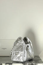 Silver structured mini handbag with quilted panels and short chain strap