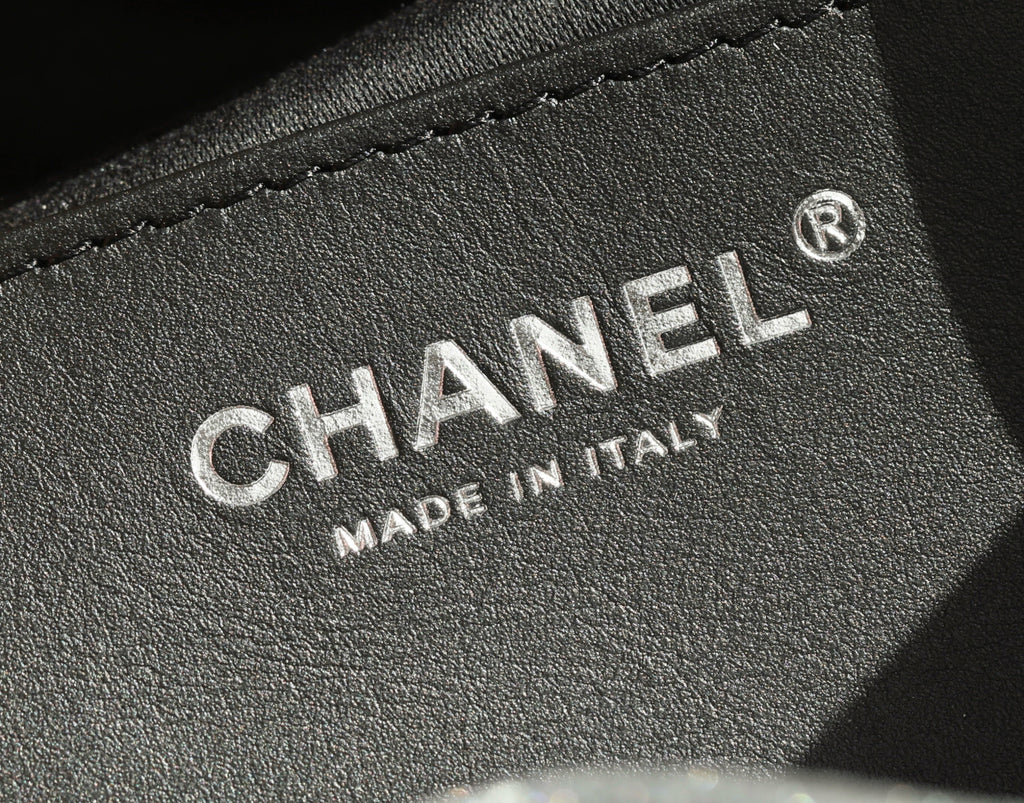 CHANEL leather label detail with "MADE IN ITALY" text and round logo