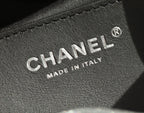 CHANEL leather label detail with "MADE IN ITALY" text and round logo