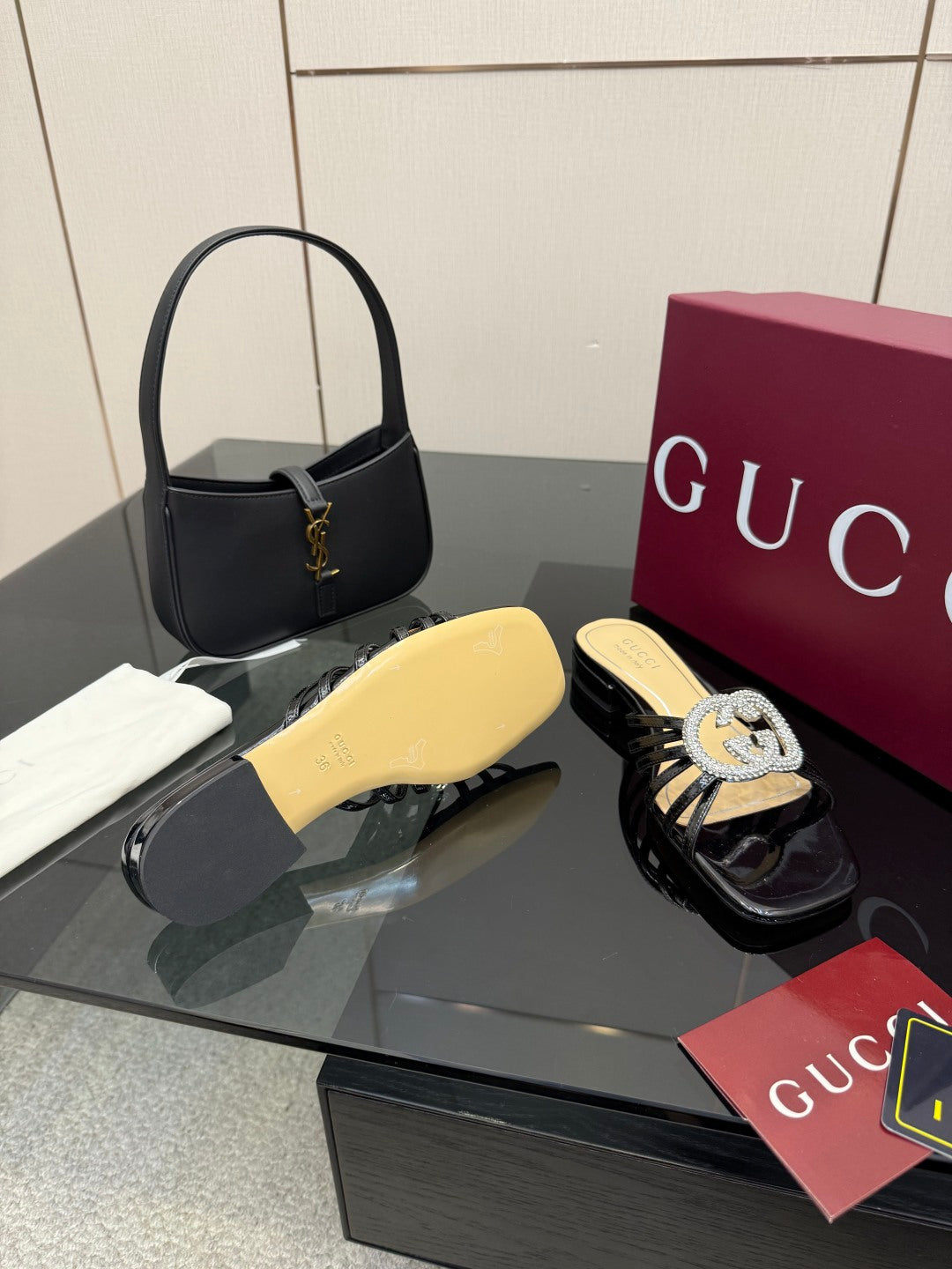 Gucci ladies black mule sandals with yellow insole and rhinestone GG emblem