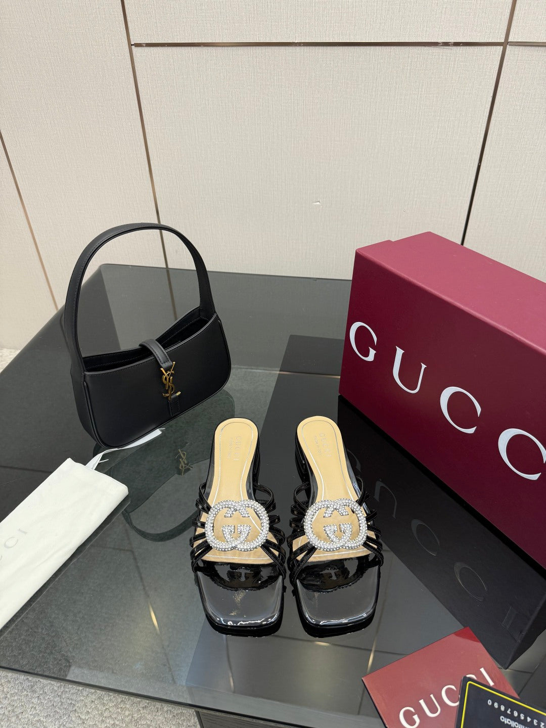 Gucci ladies black mule slide shoes with rhinestone GG emblem and block heel