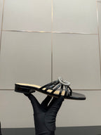 Gucci ladies black mule slide shoe with rhinestone GG emblem and striped strap detail