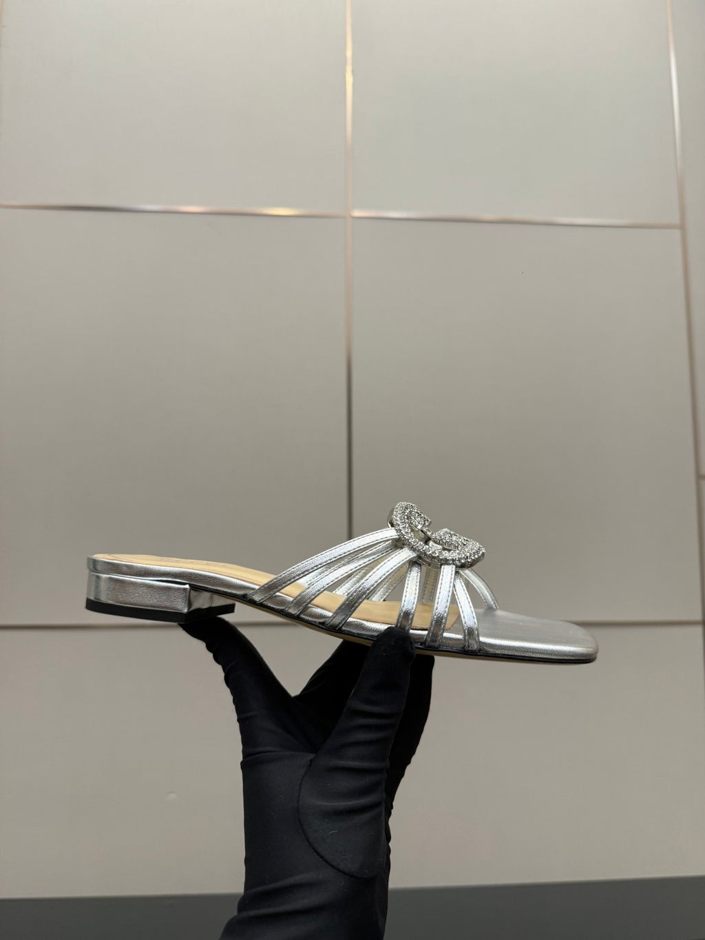Gucci ladies silver jeweled slide sandals, side profile with low flat heel