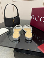 Gucci ladies crystal slide sandals with silver straps and jeweled bow on the vamp