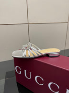 Gucci ladies silver crystal mule slides with bow detail and narrow strap across foot