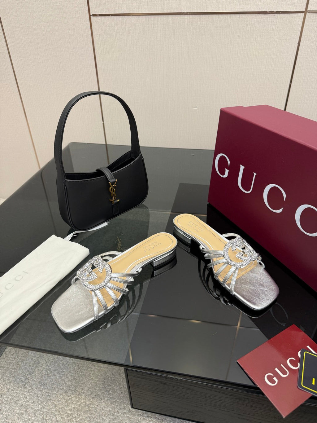 Gucci ladies jeweled slide sandals, silver upper with knot-bow ornament and low heel
